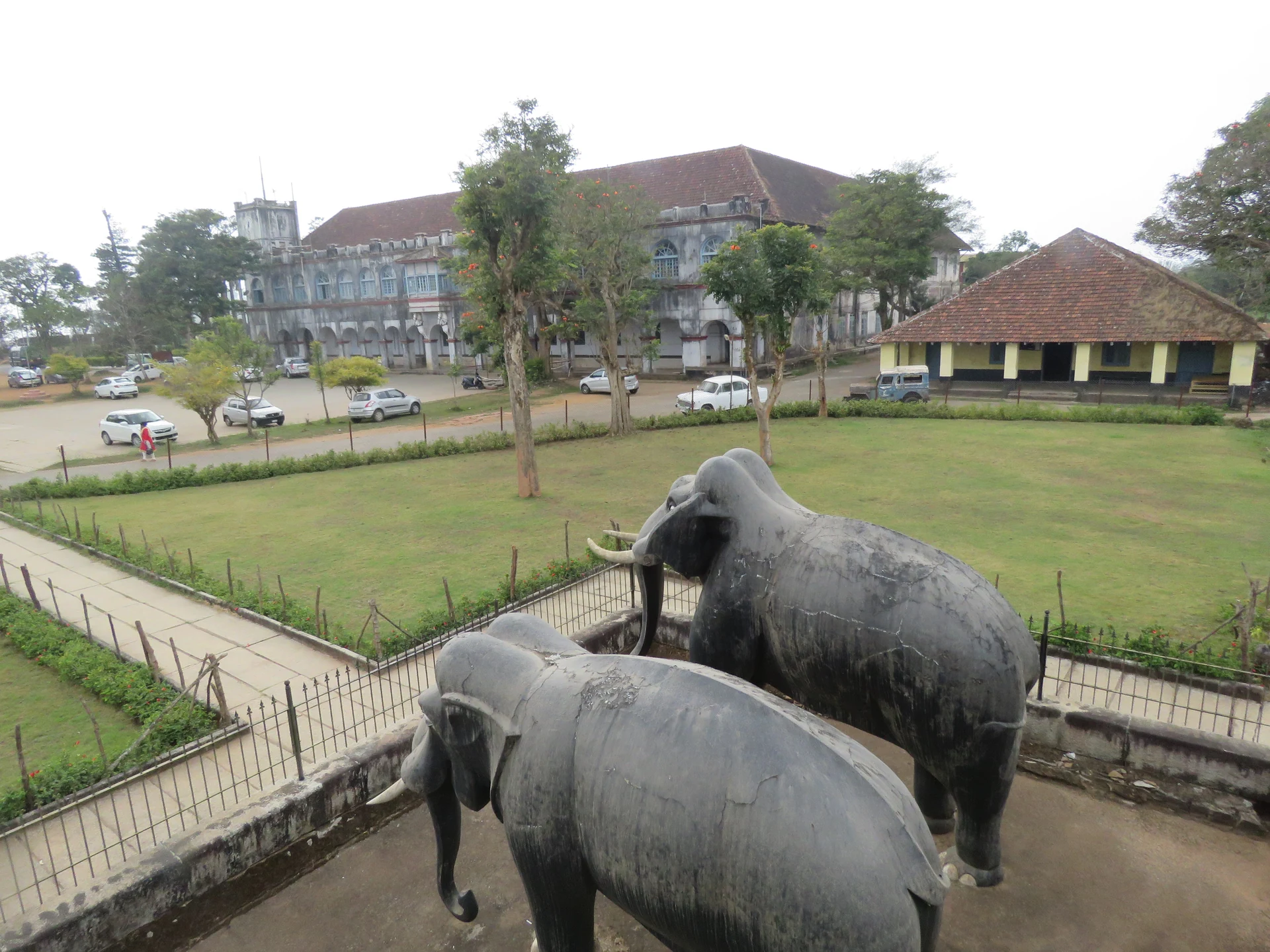 Historic buildings and elephant sculptures within Madikeri Fort